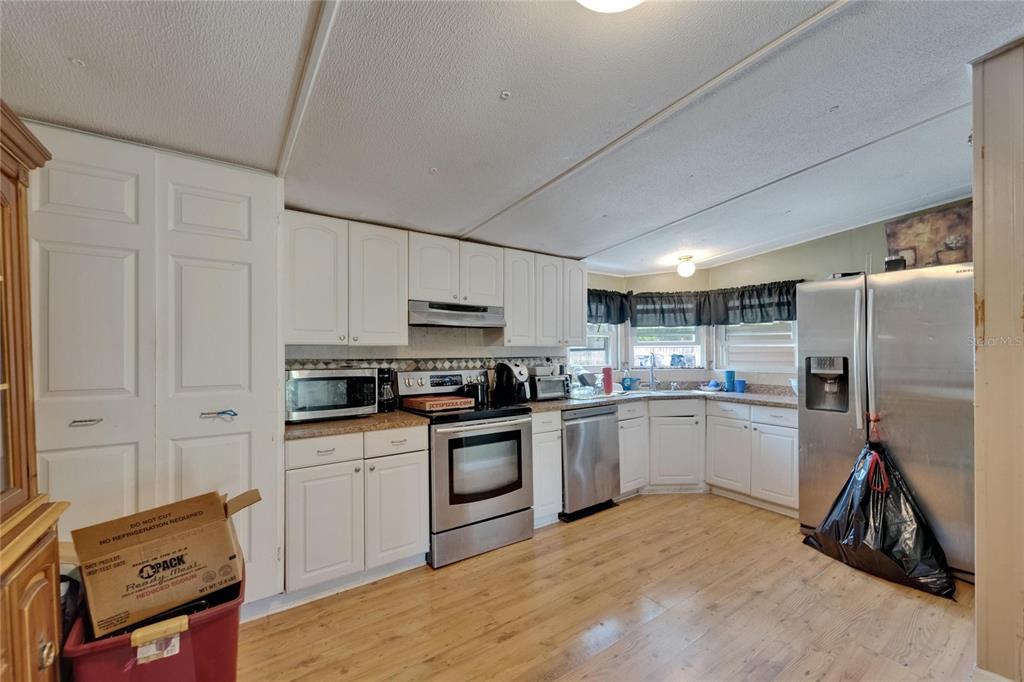 13907 Raulerson Road, Unit PARCEL A Riverview, FL 33569 - Photo 12 of 30 a kitchen with cabinets and appliances
