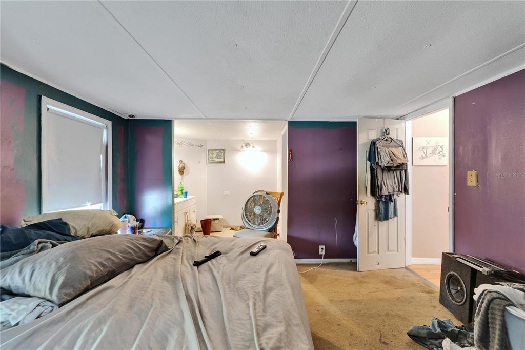 13907 Raulerson Road, Unit PARCEL A Riverview, FL 33569 - Photo 19 of 30 a bedroom with a bed and furniture