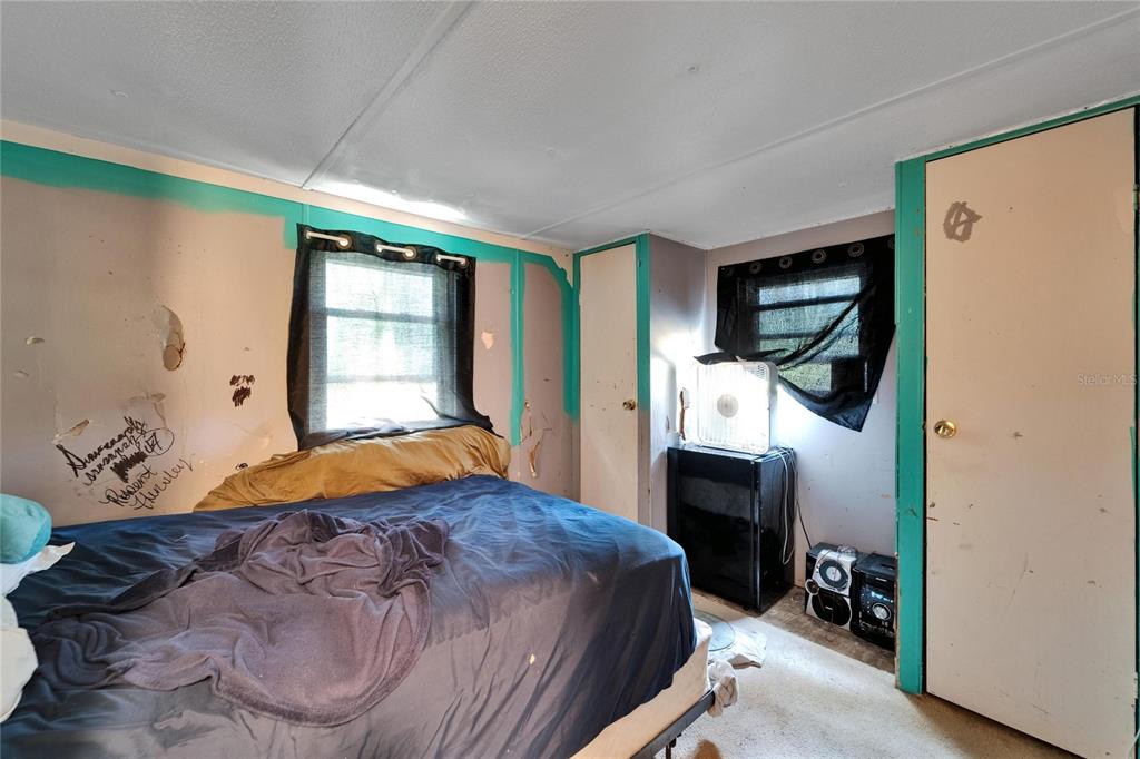 13907 Raulerson Road, Unit PARCEL A Riverview, FL 33569 - Photo 23 of 30 a bedroom with a bed dresser and a window
