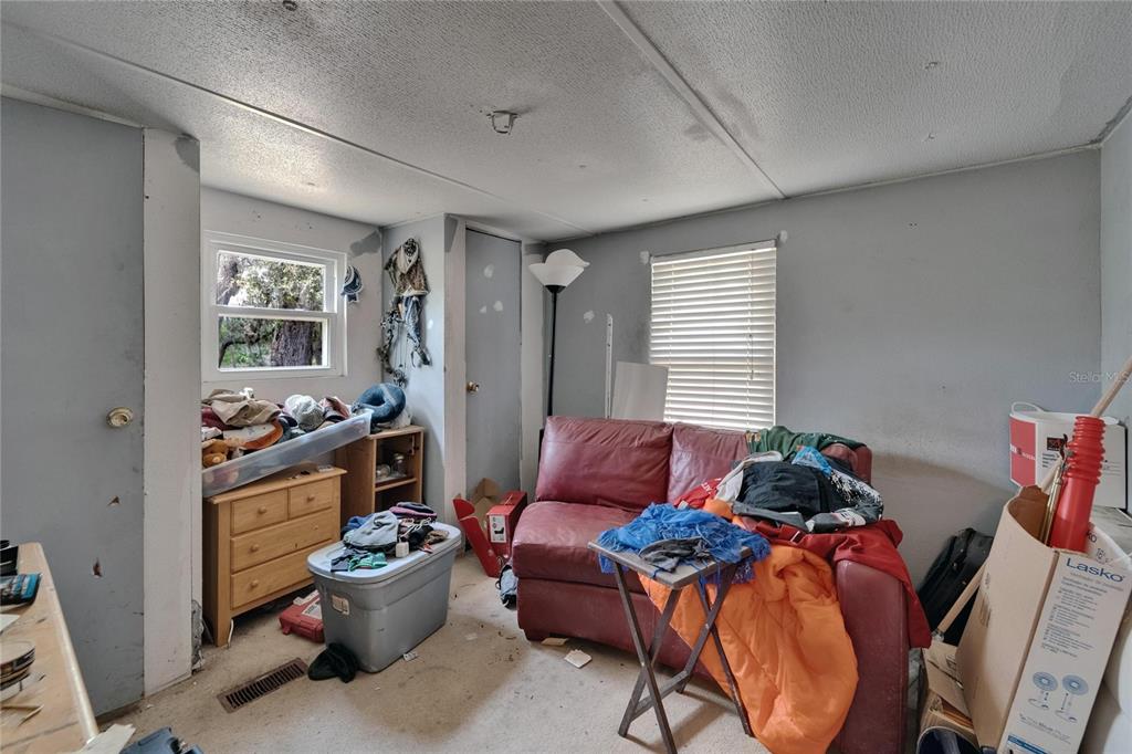 13907 Raulerson Road, Unit PARCEL A Riverview, FL 33569 - Photo 25 of 30 a living room with furniture and a window