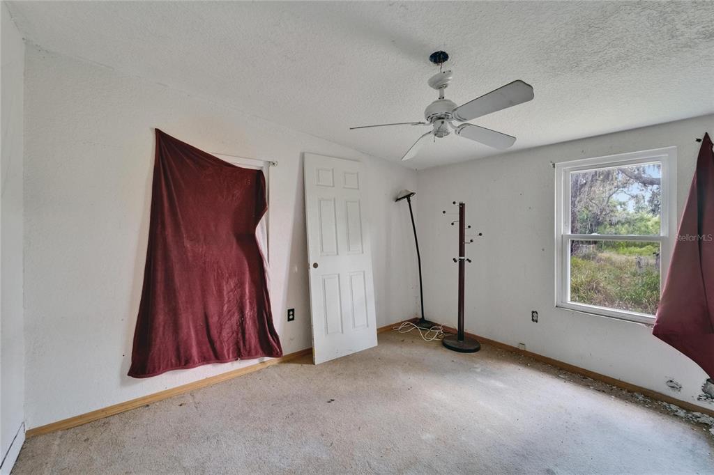 13907 Raulerson Road, Unit PARCEL A Riverview, FL 33569 - Photo 27 of 30 a view of a room with window and a ceiling fan
