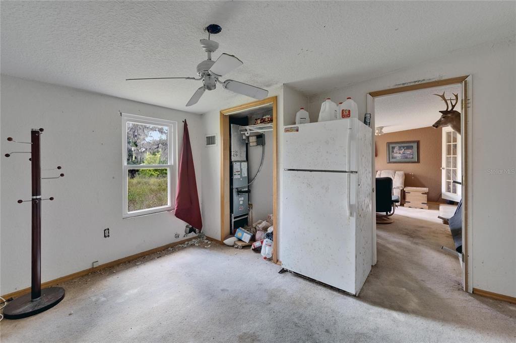 13907 Raulerson Road, Unit PARCEL A Riverview, FL 33569 - Photo 28 of 30 a view of a livingroom with a furniture ceiling fan and window