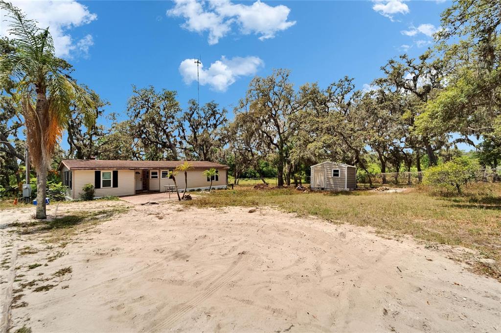 13907 Raulerson Road, Unit PARCEL A Riverview, FL 33569 - Photo 8 of 30 a front view of a house with a yard covered with snow