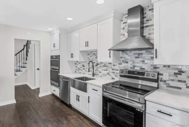 a kitchen with a stove and a sink