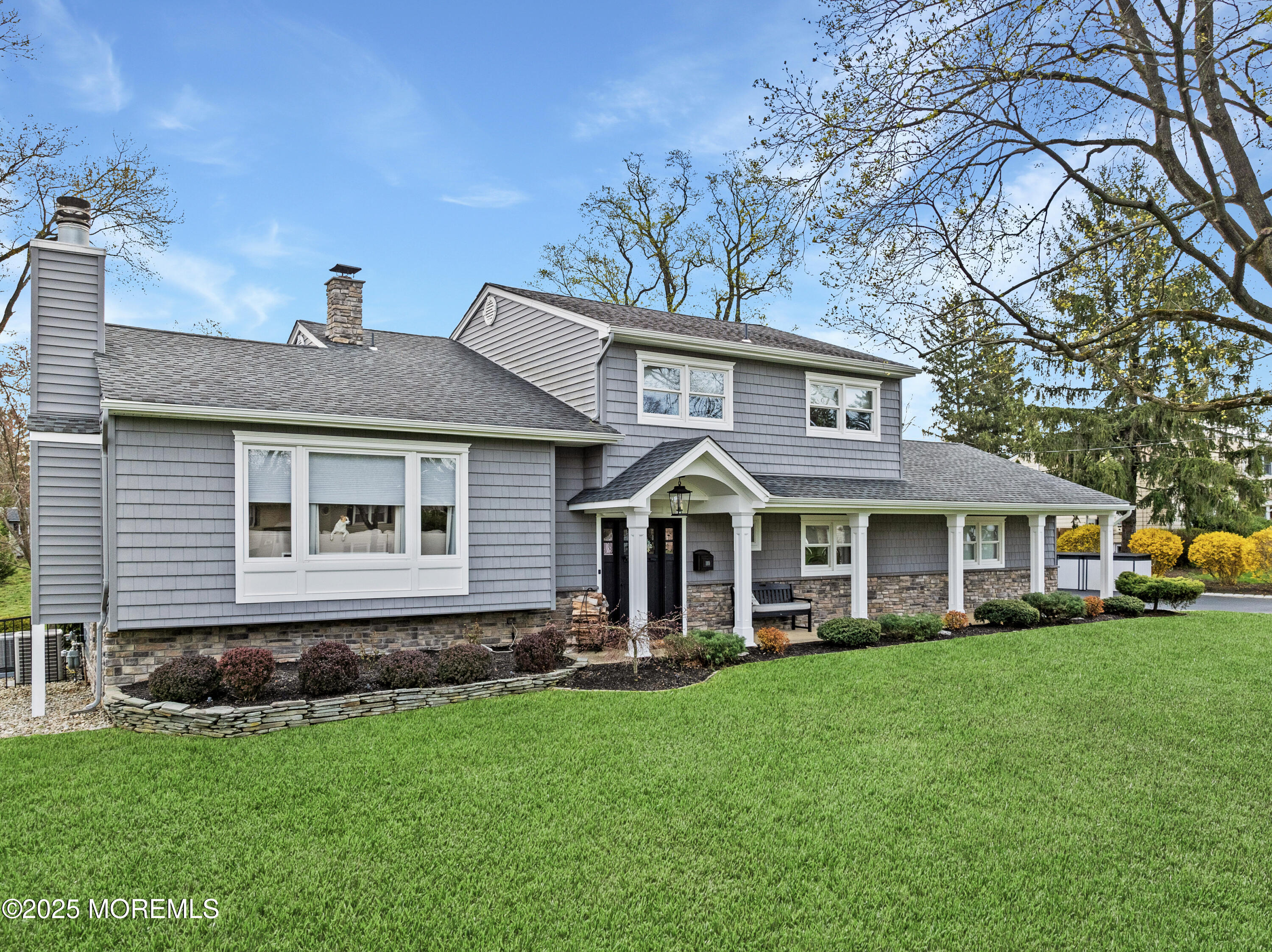 110 Jumping Brook Road Lincroft, NJ 07738 - Photo 1 of 48 a front view of a house with a garden