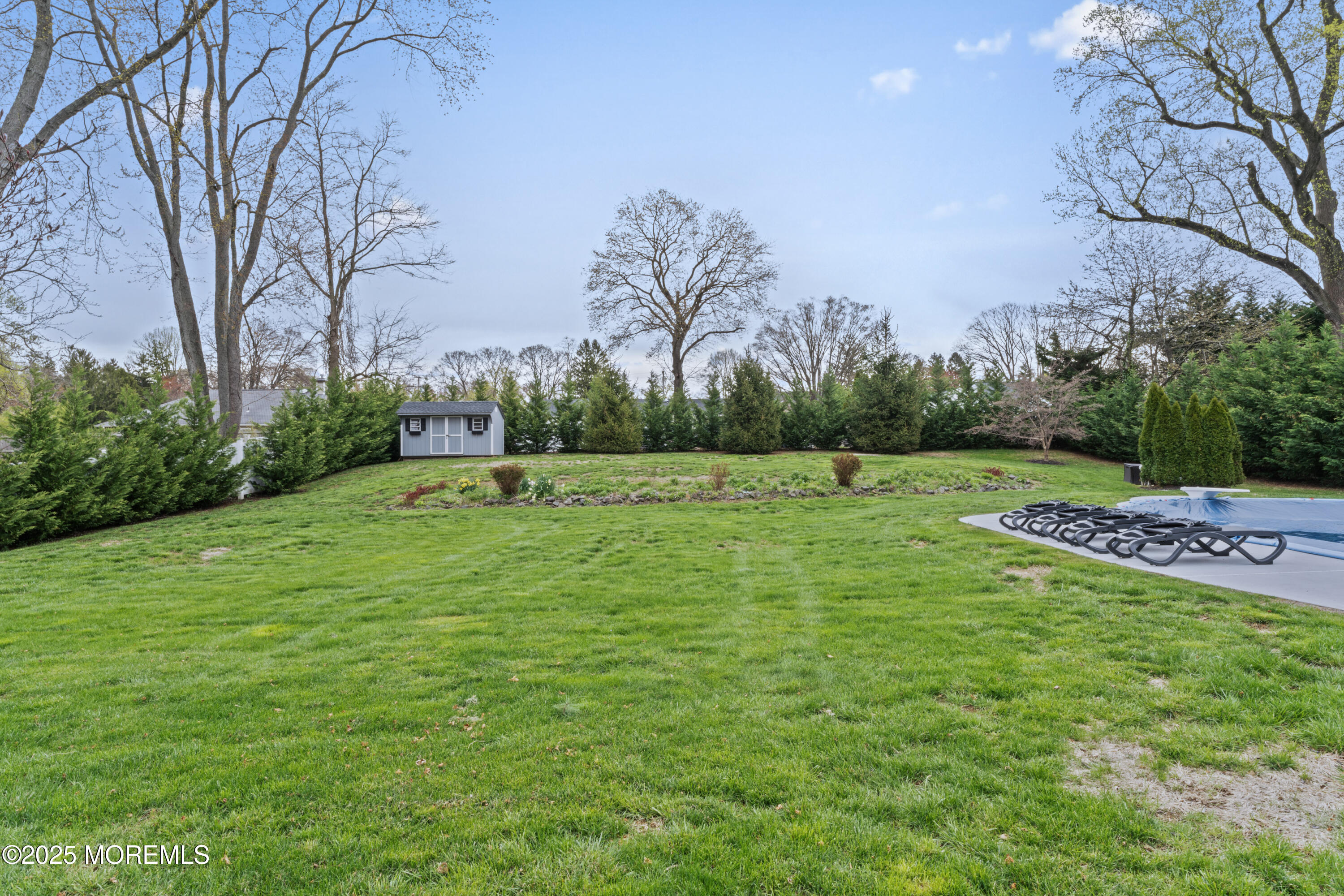 110 Jumping Brook Road Lincroft, NJ 07738 - Photo 43 of 48 a garden with a tree in the background