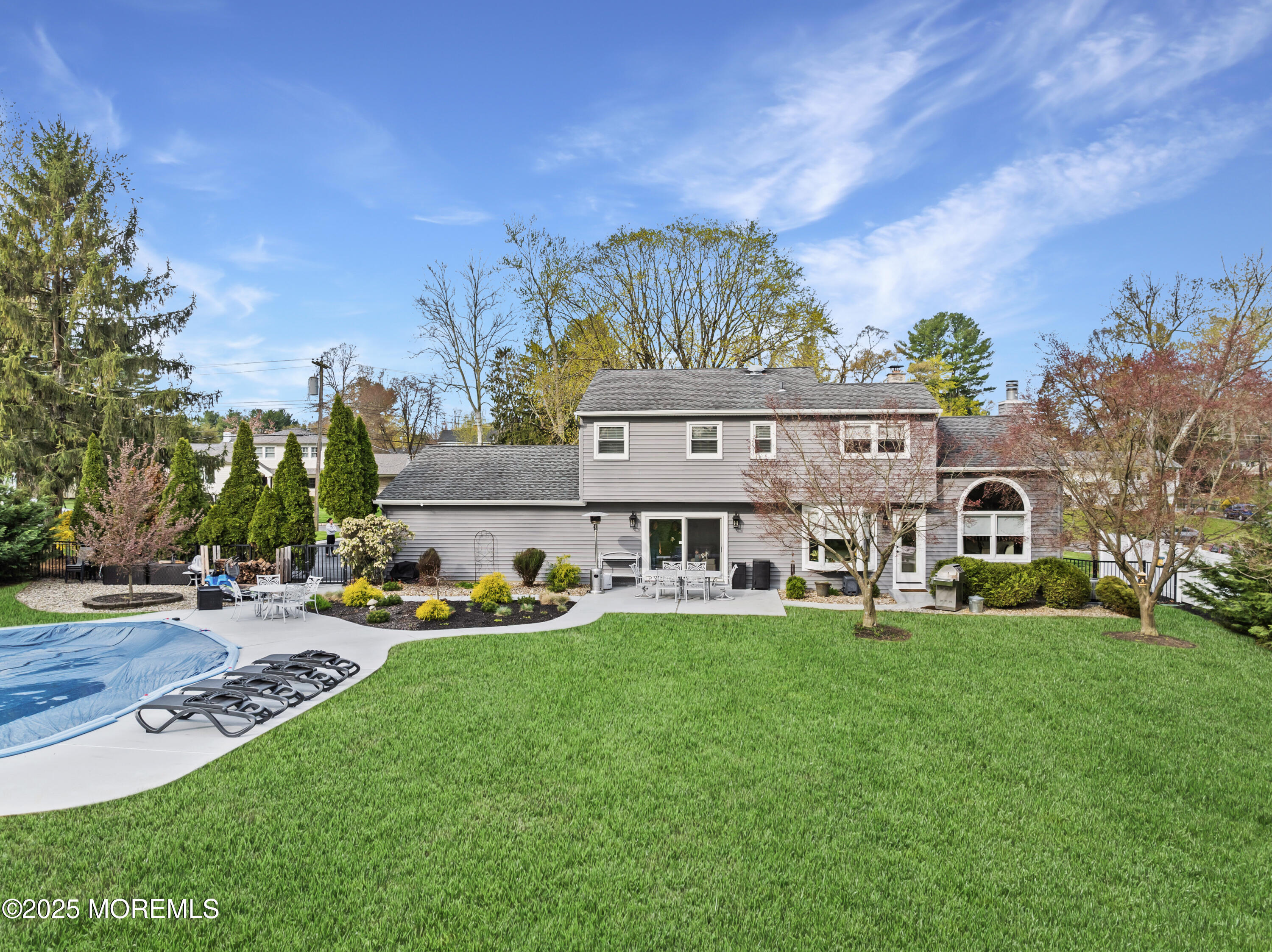 110 Jumping Brook Road Lincroft, NJ 07738 - Photo 9 of 48 a view of a house with a big yard and large trees