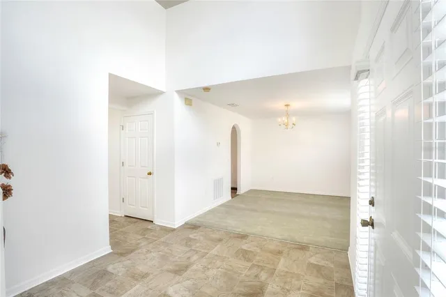a view of a big room with a kitchen