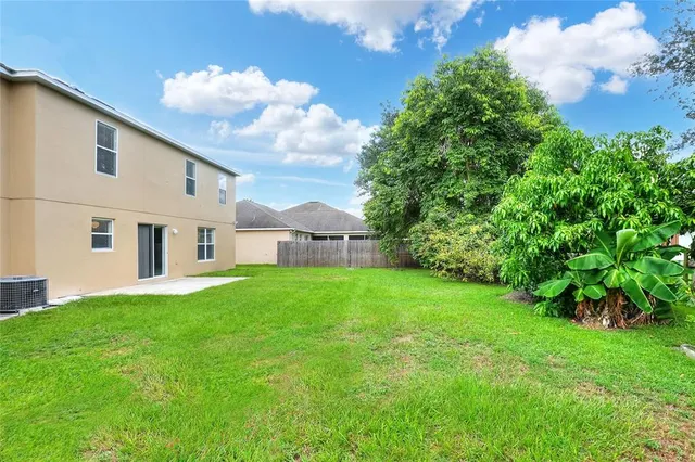 a view of a backyard of a house