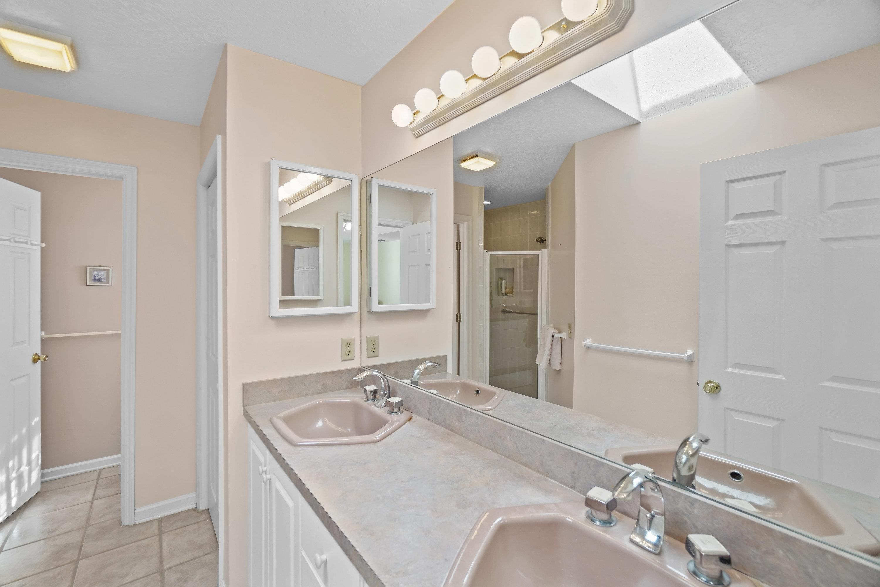 216 Wisteria Road St. Augustine, FL 32086 - Photo 15 of 35 a bathroom with a sink vanity and a mirror