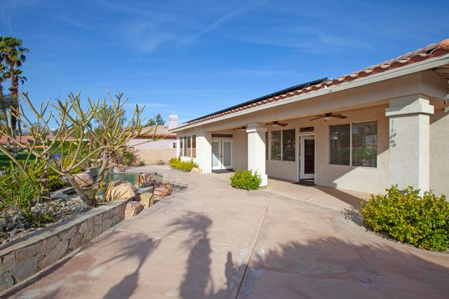 a front view of a house with a patio