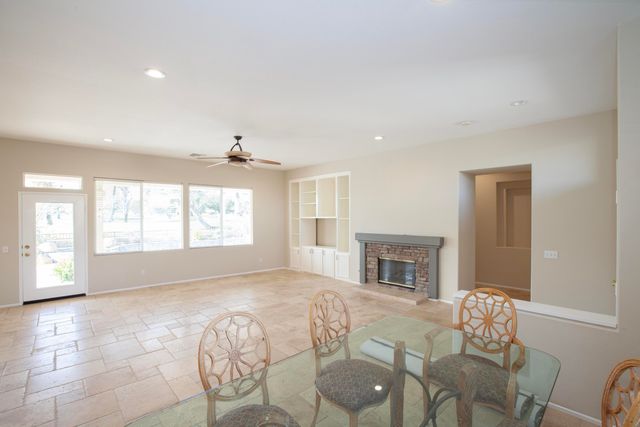 a bedroom with a bed and a fireplace