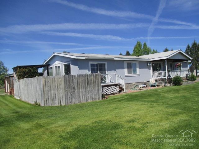 58068 Maple Circle Road Christmas Valley, OR 97641 - Photo 2 of 23 Side and Front of home and beautiful Law
