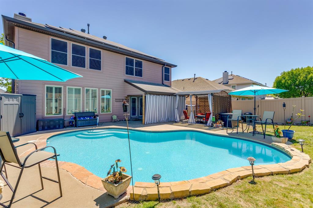4816 Sleepy Ridge Circle Fort Worth, TX 76133 - Photo 29 of 36 View of swimming pool with patio surround, a fenced backyard, and a storage shed