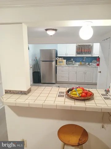 a kitchen with stainless steel appliances granite countertop a sink and a stove