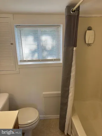 a bathroom with a toilet and a sink