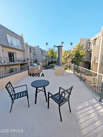 a swimming pool with outdoor seating and a couch