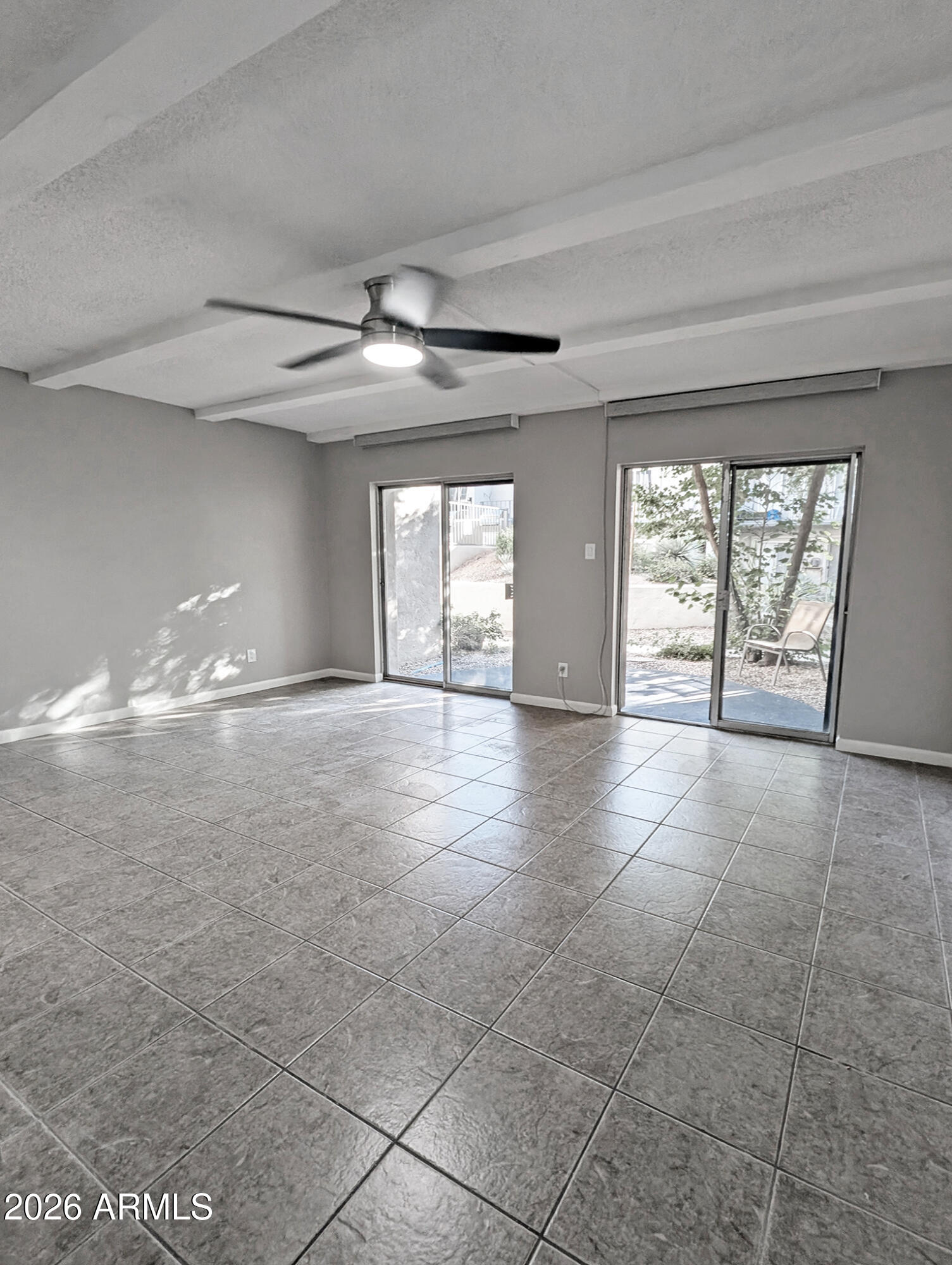 1018 East Osborn Road, Unit A Phoenix, AZ 85014 - Photo 3 of 18 a view of an empty room with a window