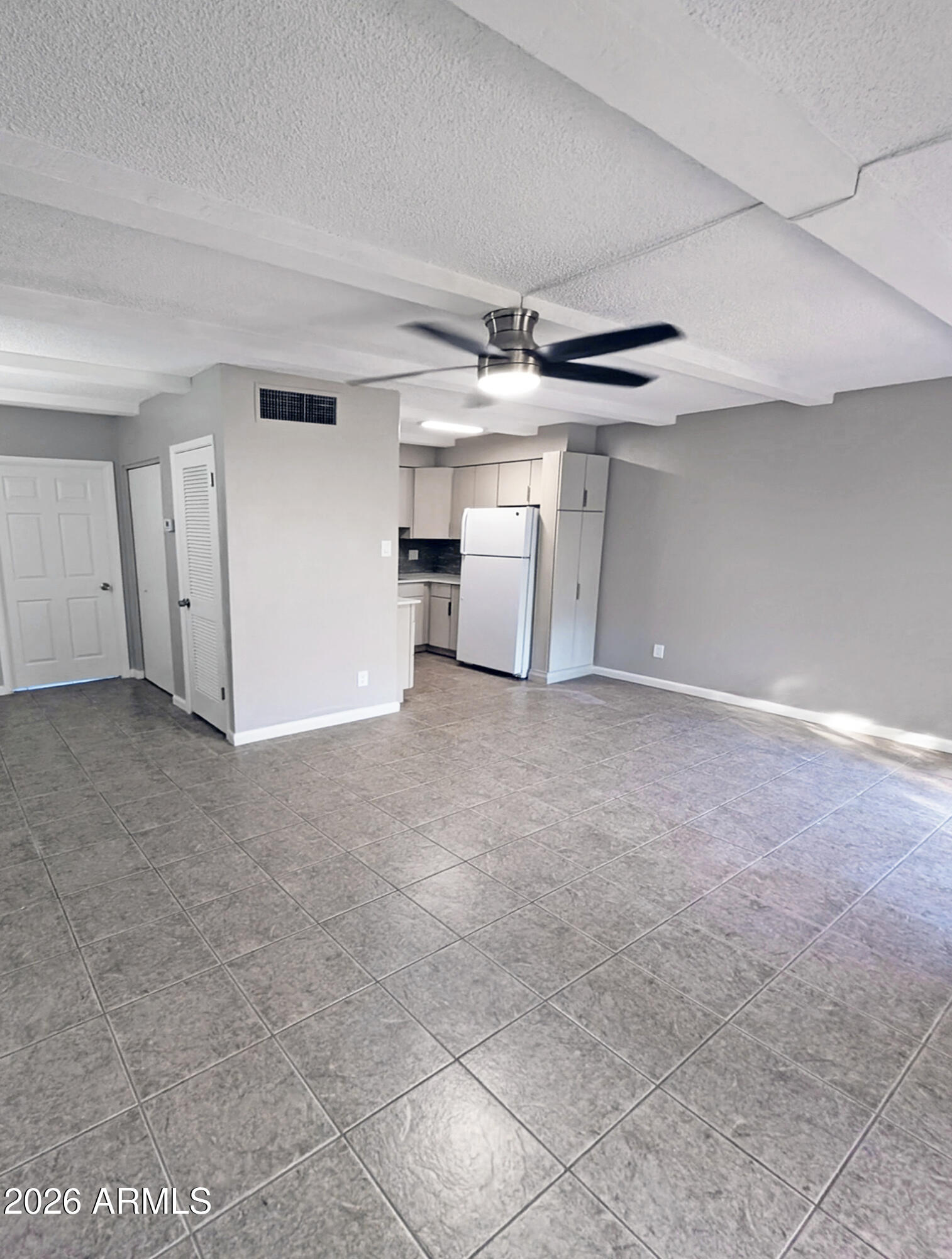 1018 East Osborn Road, Unit A Phoenix, AZ 85014 - Photo 18 of 18 a view of a livingroom with a ceiling fan