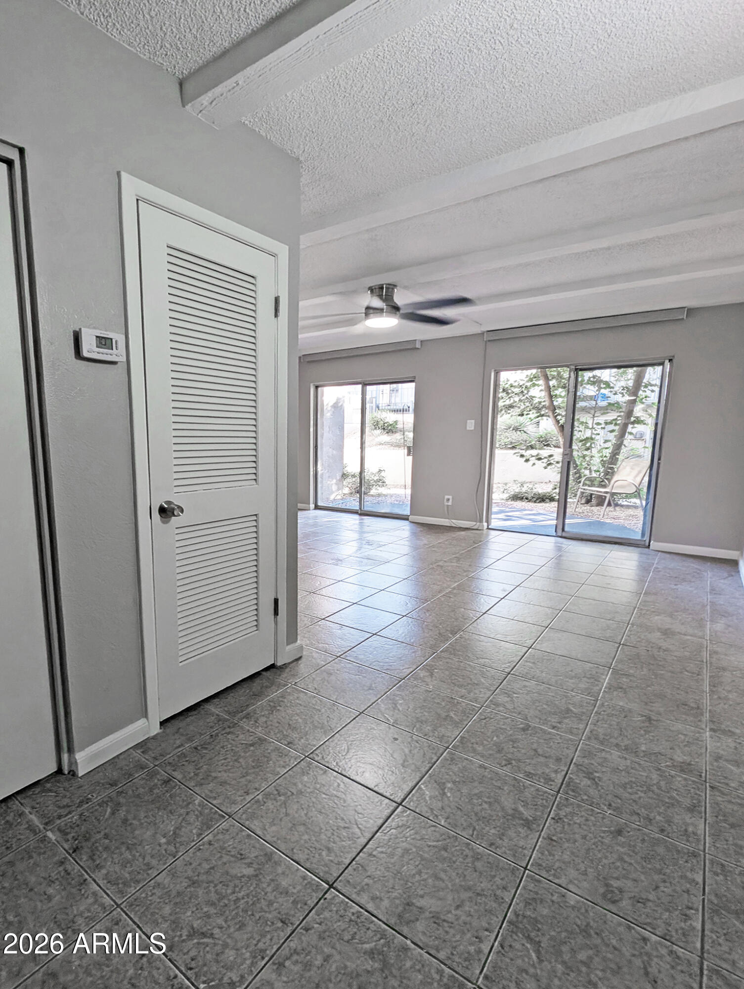 1018 East Osborn Road, Unit A Phoenix, AZ 85014 - Photo 4 of 18 a view of an empty room and window