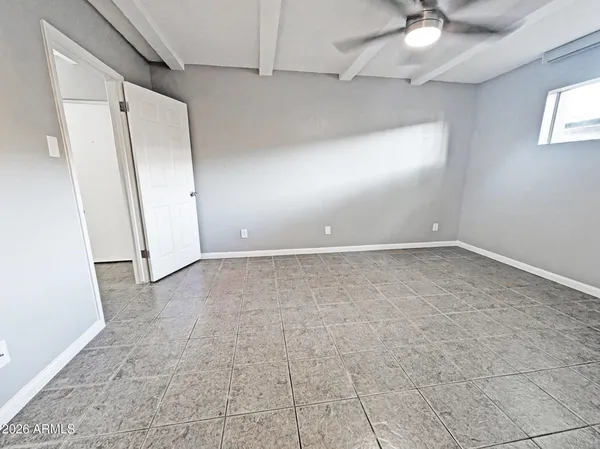 a view of an empty room and window