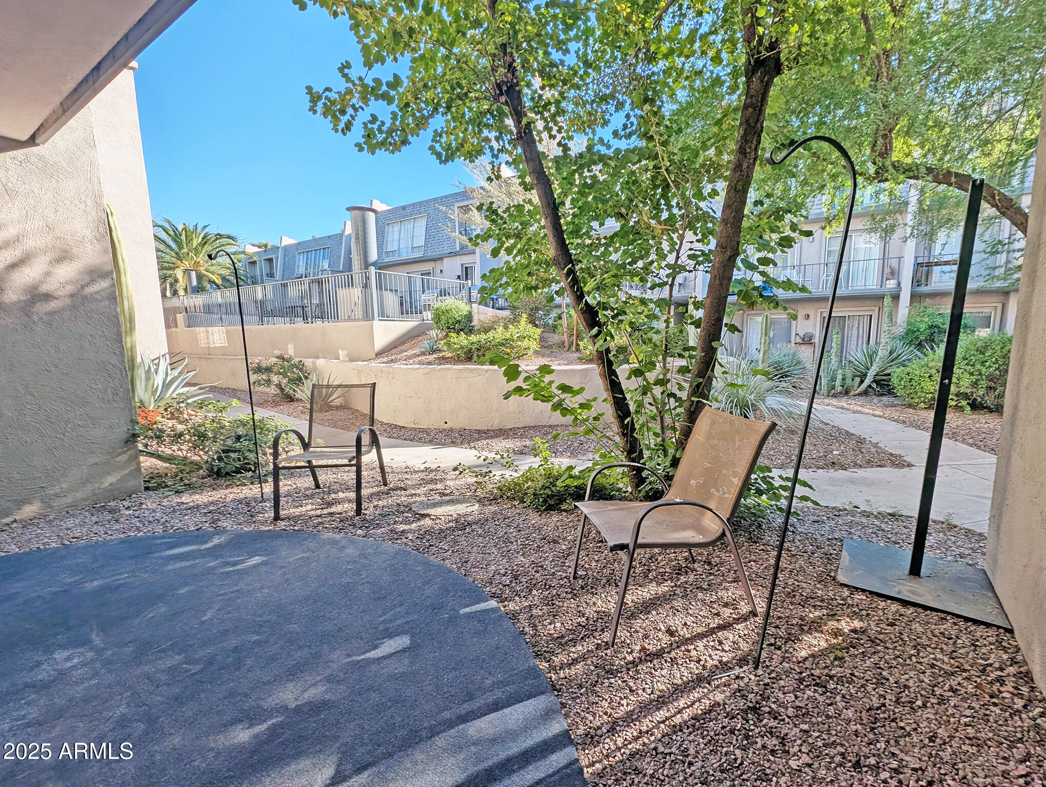 1018 East Osborn Road, Unit A Phoenix, AZ 85014 - Photo 9 of 18 a view of a chairs and table in backyard