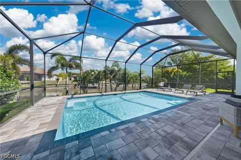 a view of a swimming pool with a patio