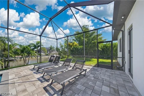 a view of swimming pool with a patio and a yard