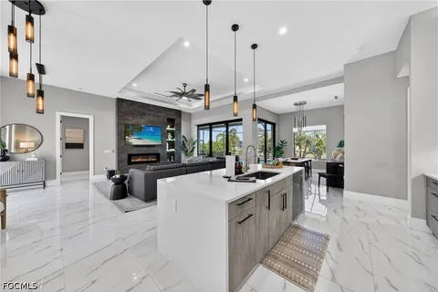 a kitchen with stove and cabinets