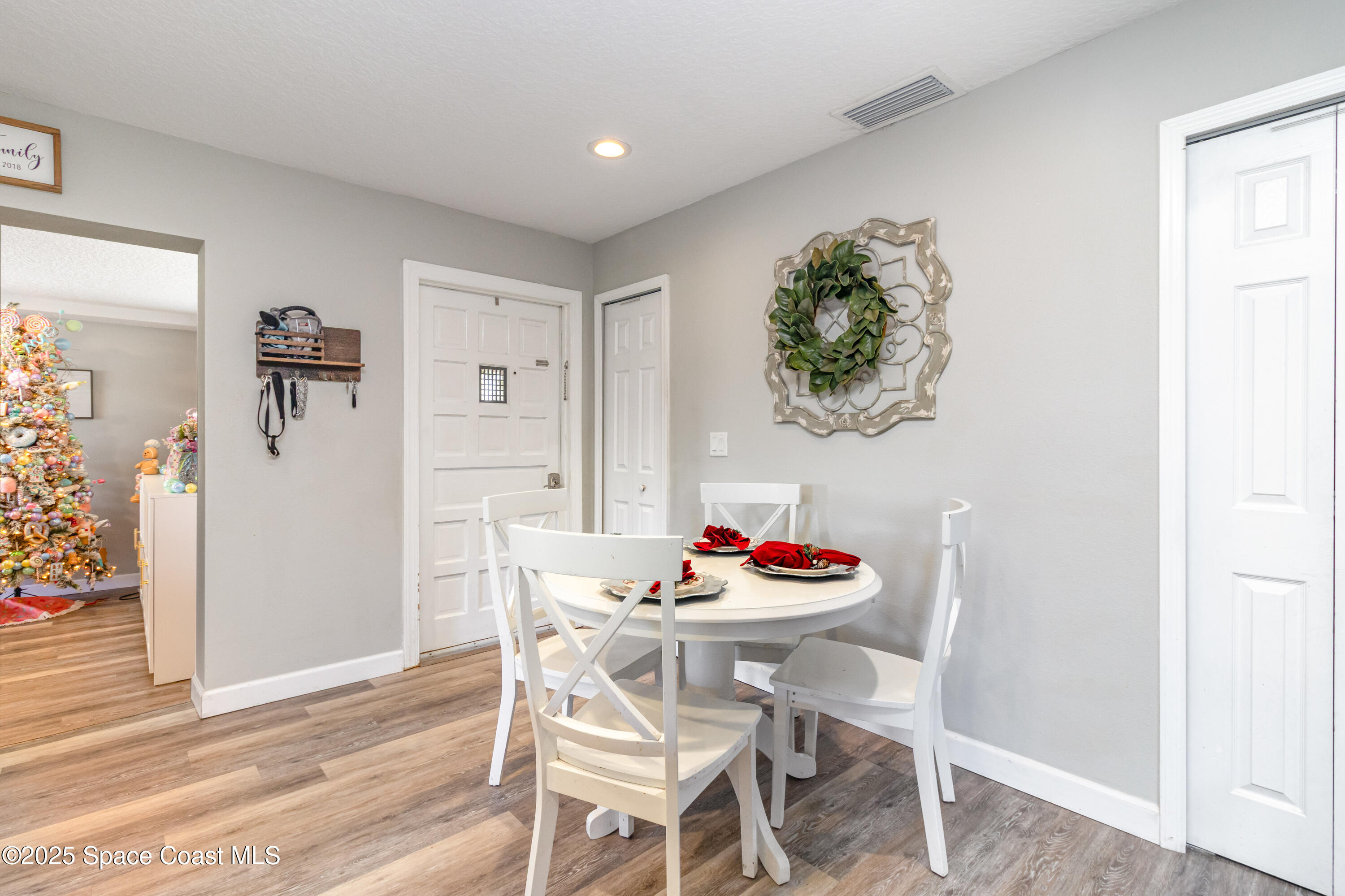 964 Bucknell Place Rockledge, FL 32955 - Photo 11 of 30 a dining room with furniture and wooden floor