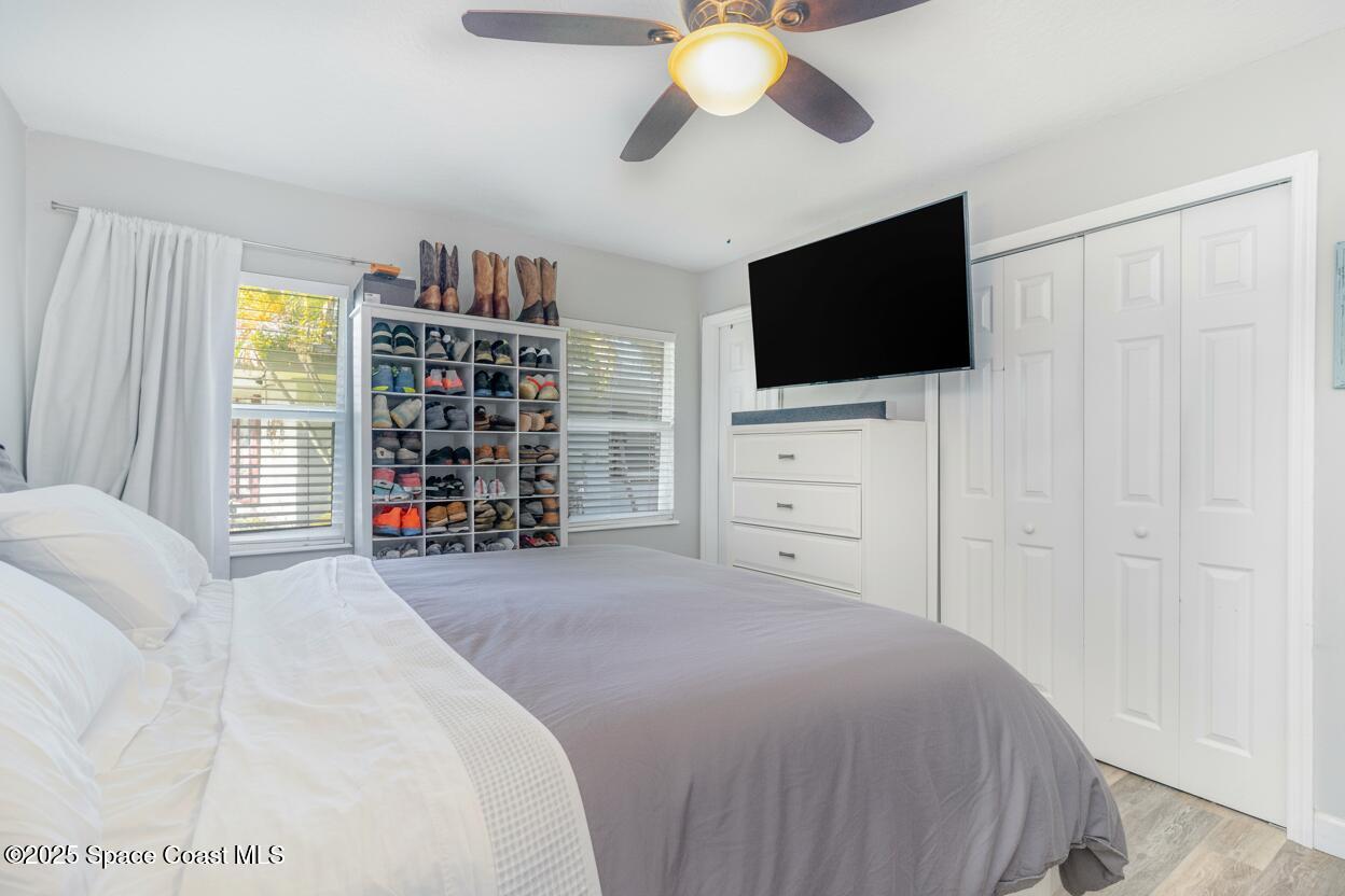 964 Bucknell Place Rockledge, FL 32955 - Photo 13 of 30 a bedroom with a bed and a flat screen tv
