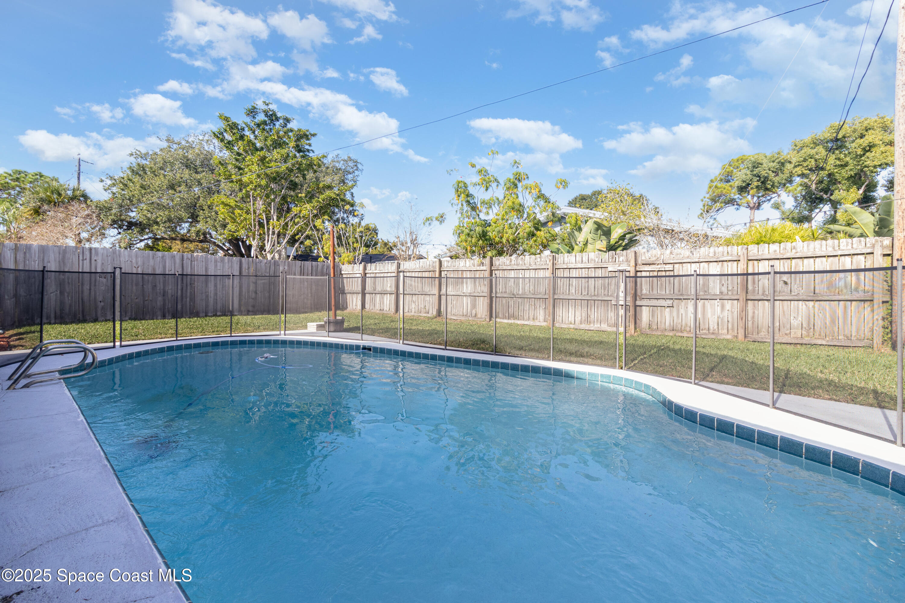 964 Bucknell Place Rockledge, FL 32955 - Photo 22 of 30 a view of a swimming pool with a patio