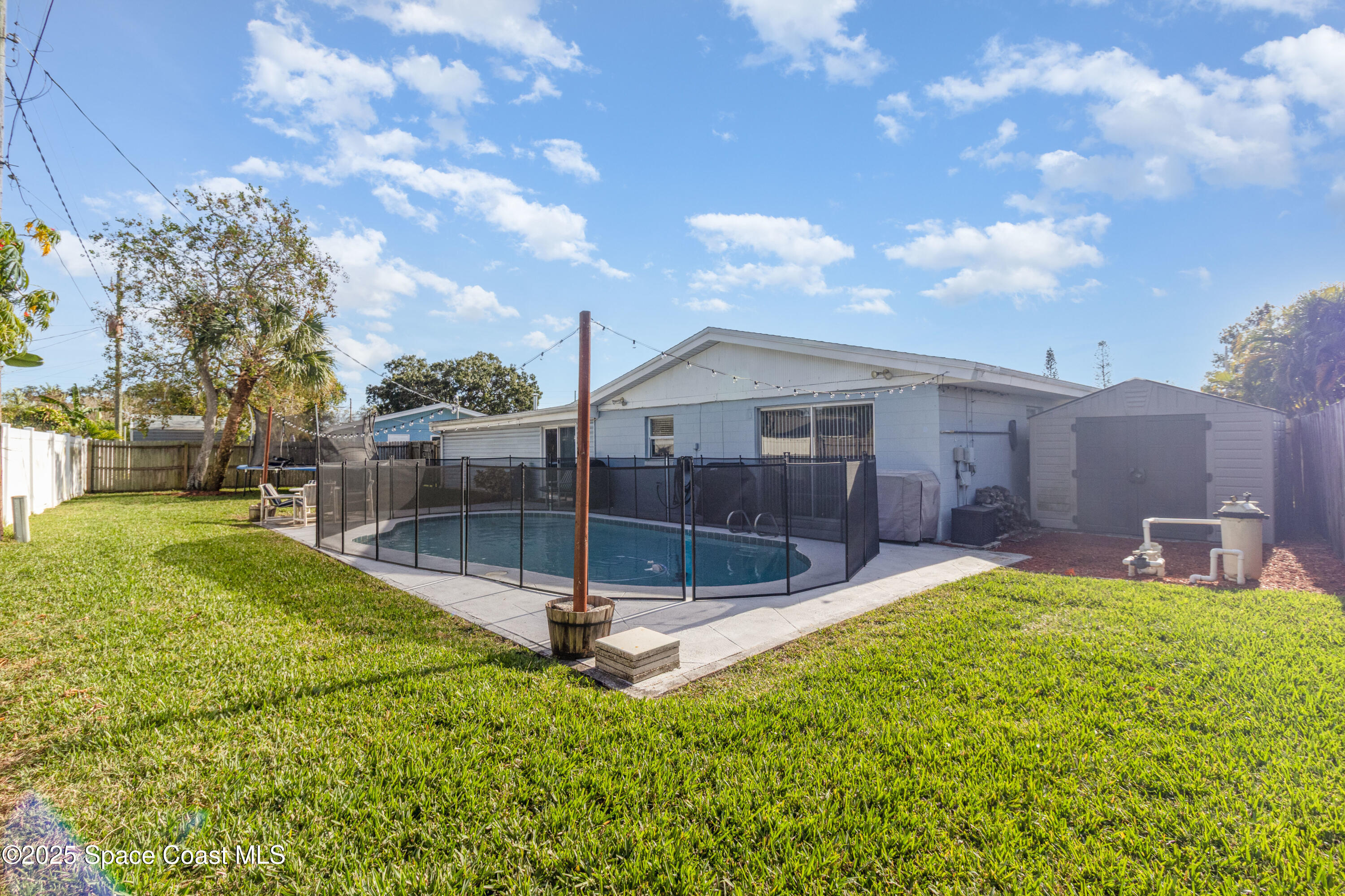 964 Bucknell Place Rockledge, FL 32955 - Photo 24 of 30 a view of a backyard with a garden and plants