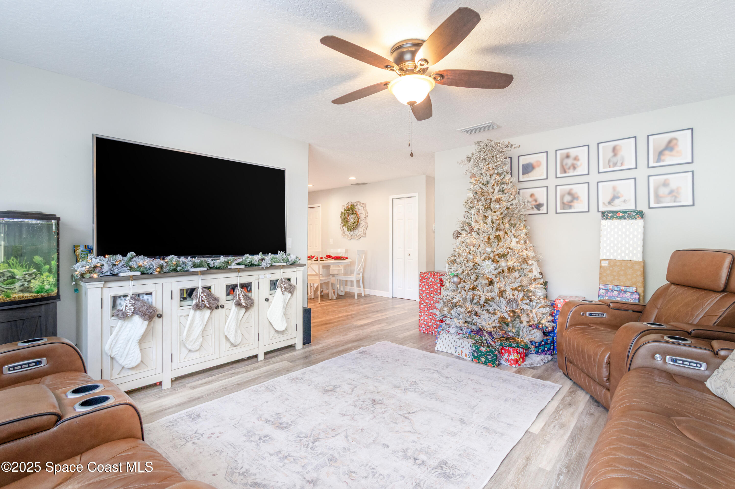 964 Bucknell Place Rockledge, FL 32955 - Photo 4 of 30 a living room with furniture and a flat screen tv