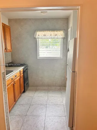 a view of a kitchen with a sink