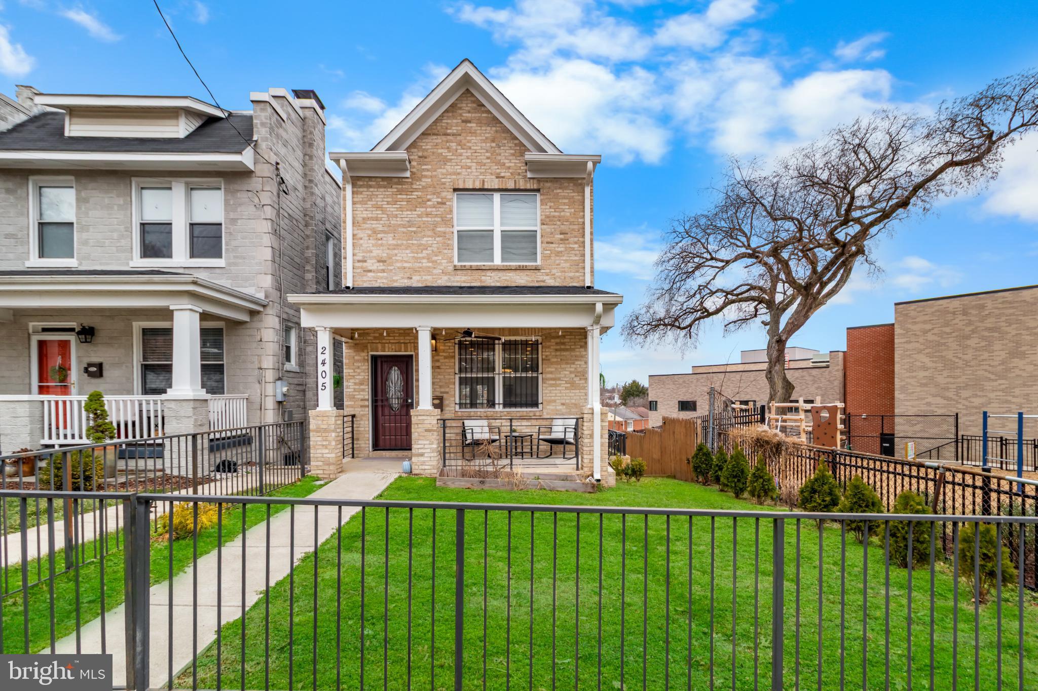 2405 Naylor Road Southeast Washington, DC 20020 - Photo 1 of 23 a front view of a house with a yard table and chairs