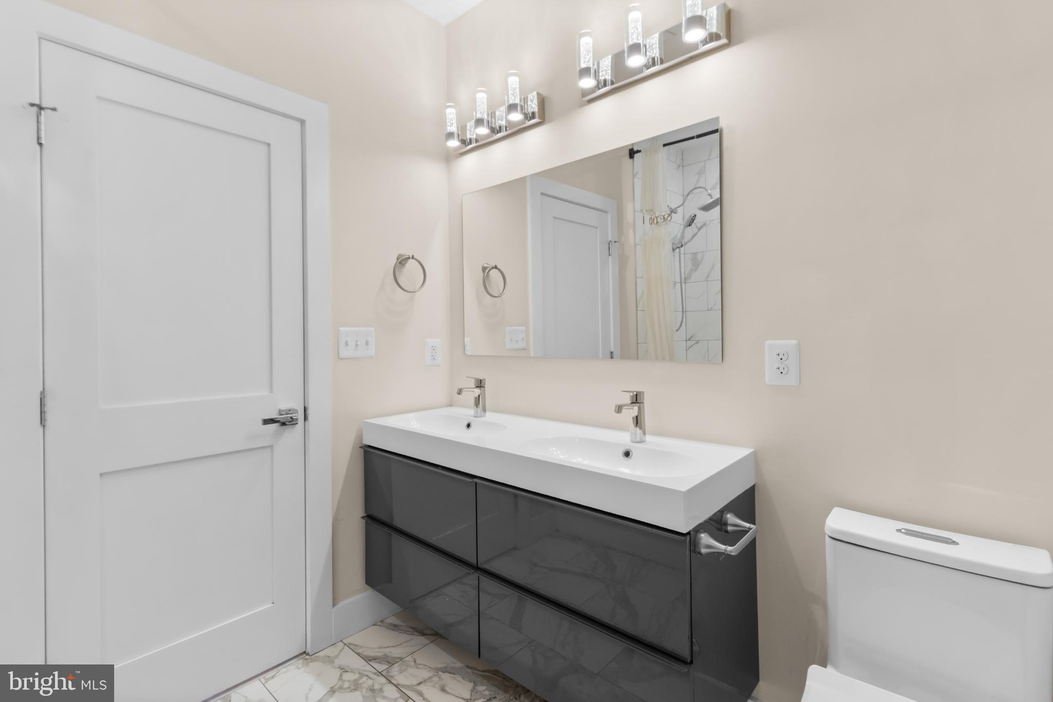 2405 Naylor Road Southeast Washington, DC 20020 - Photo 11 of 23 a bathroom with a sink a toilet and shower