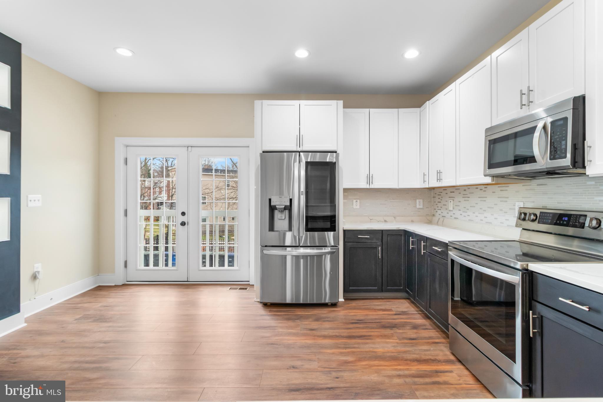 2405 Naylor Road Southeast Washington, DC 20020 - Photo 13 of 23 a kitchen with stainless steel appliances granite countertop a refrigerator stove top oven and sink