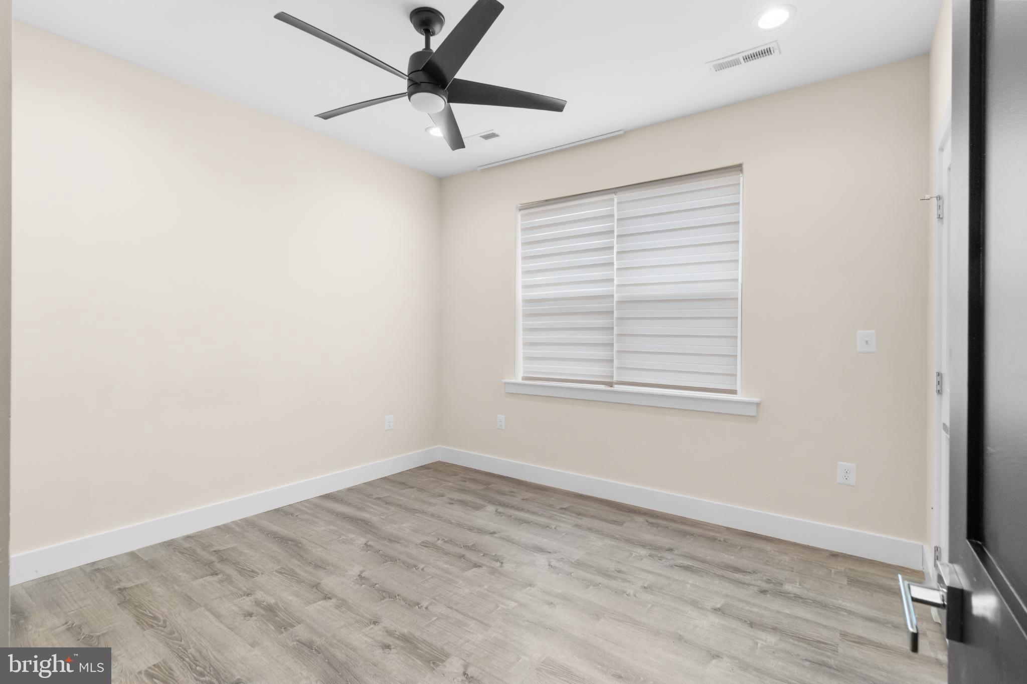 2405 Naylor Road Southeast Washington, DC 20020 - Photo 15 of 23 a view of empty room with wooden floor and fan