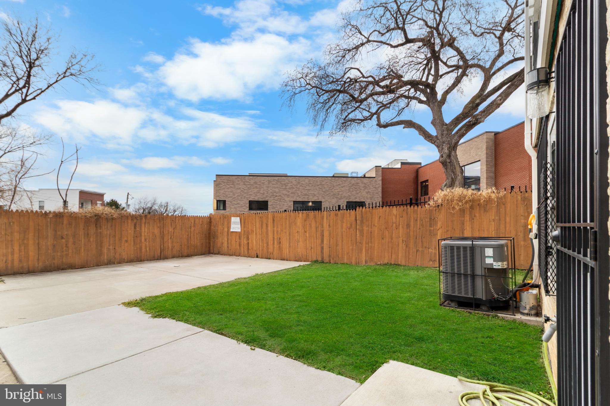 2405 Naylor Road Southeast Washington, DC 20020 - Photo 19 of 23 a backyard of a house with lots of green space