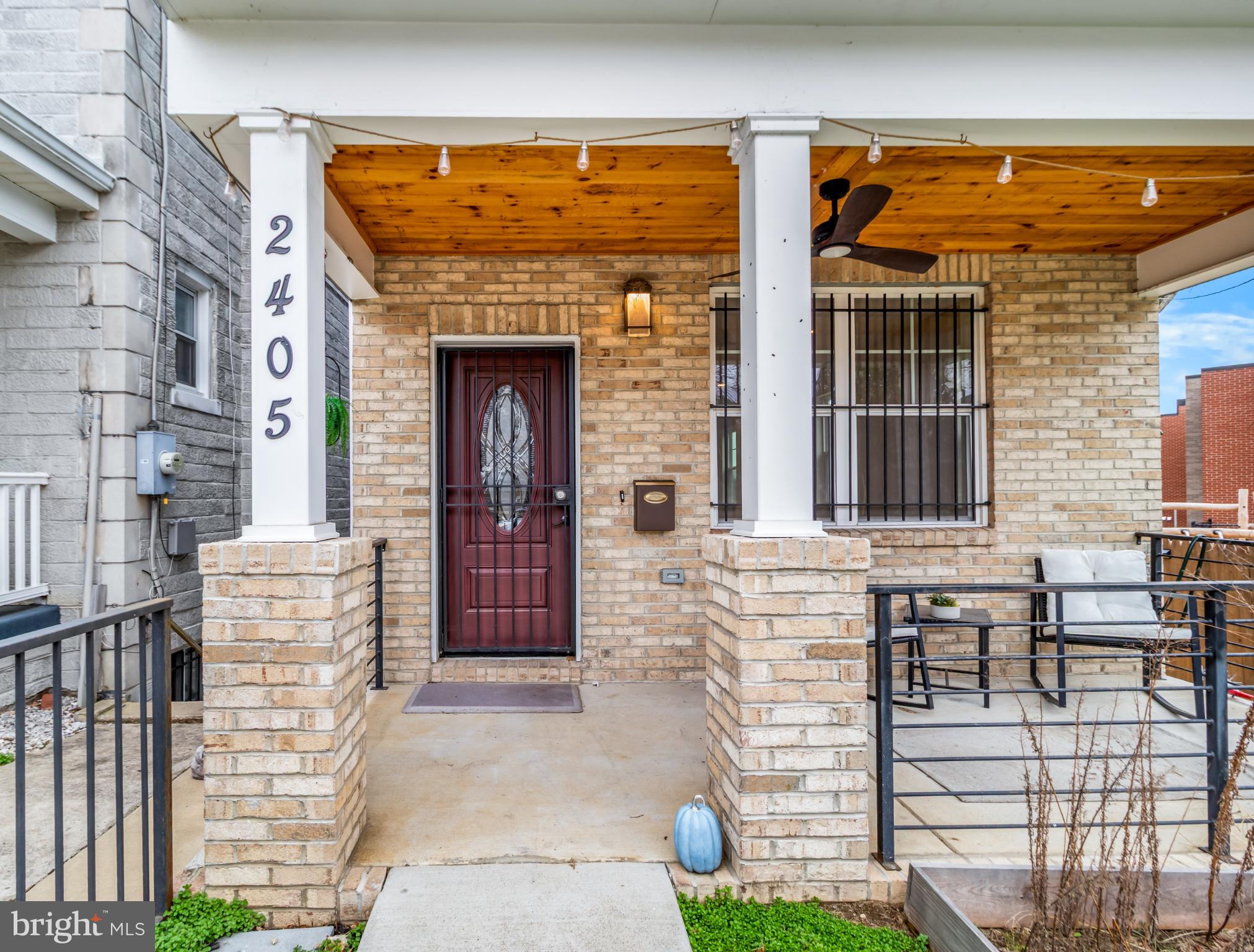 2405 Naylor Road Southeast Washington, DC 20020 - Photo 2 of 23 a front view of a house with a garden