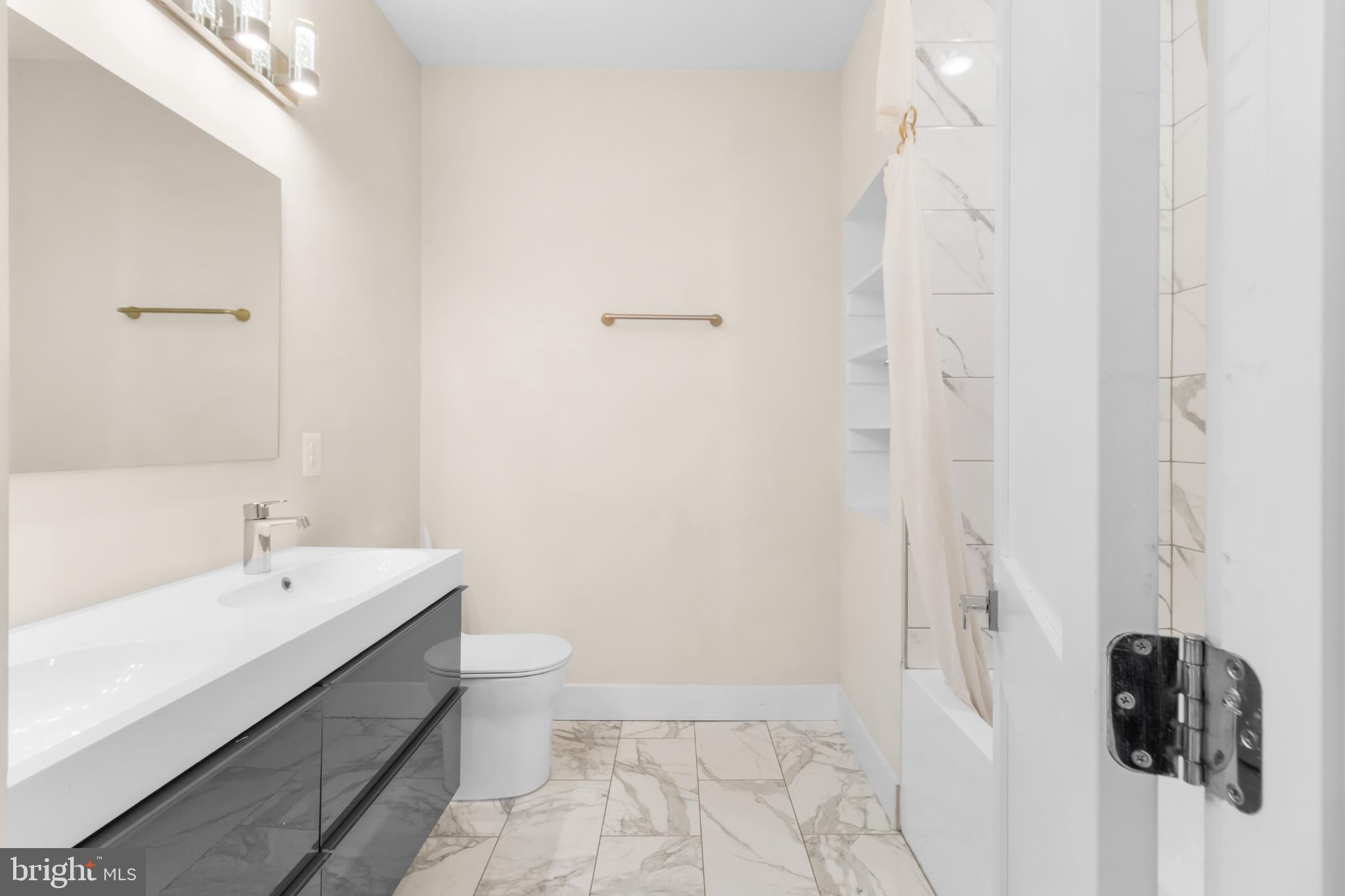 2405 Naylor Road Southeast Washington, DC 20020 - Photo 22 of 23 a bathroom with a sink a toilet and shower