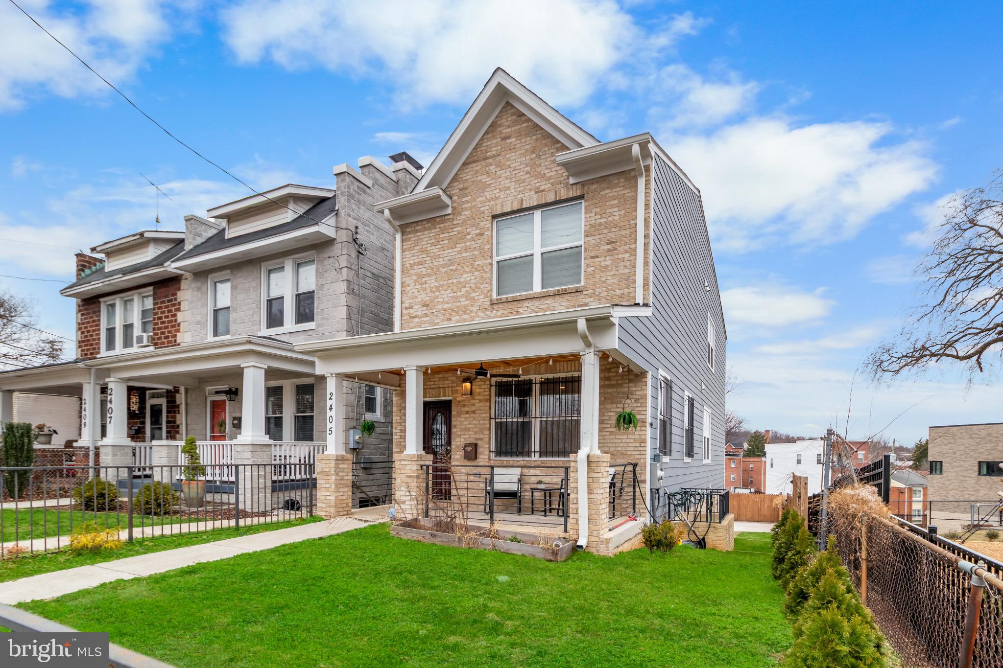 2405 Naylor Road Southeast Washington, DC 20020 - Photo 3 of 23 a front view of a house with a yard