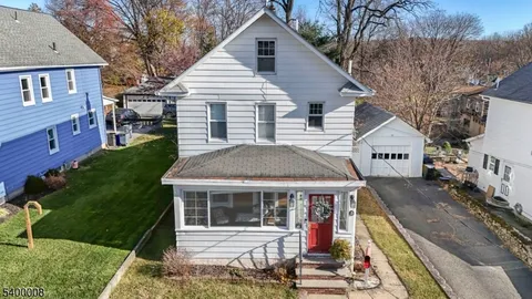 a view of house with yard and entertaining space