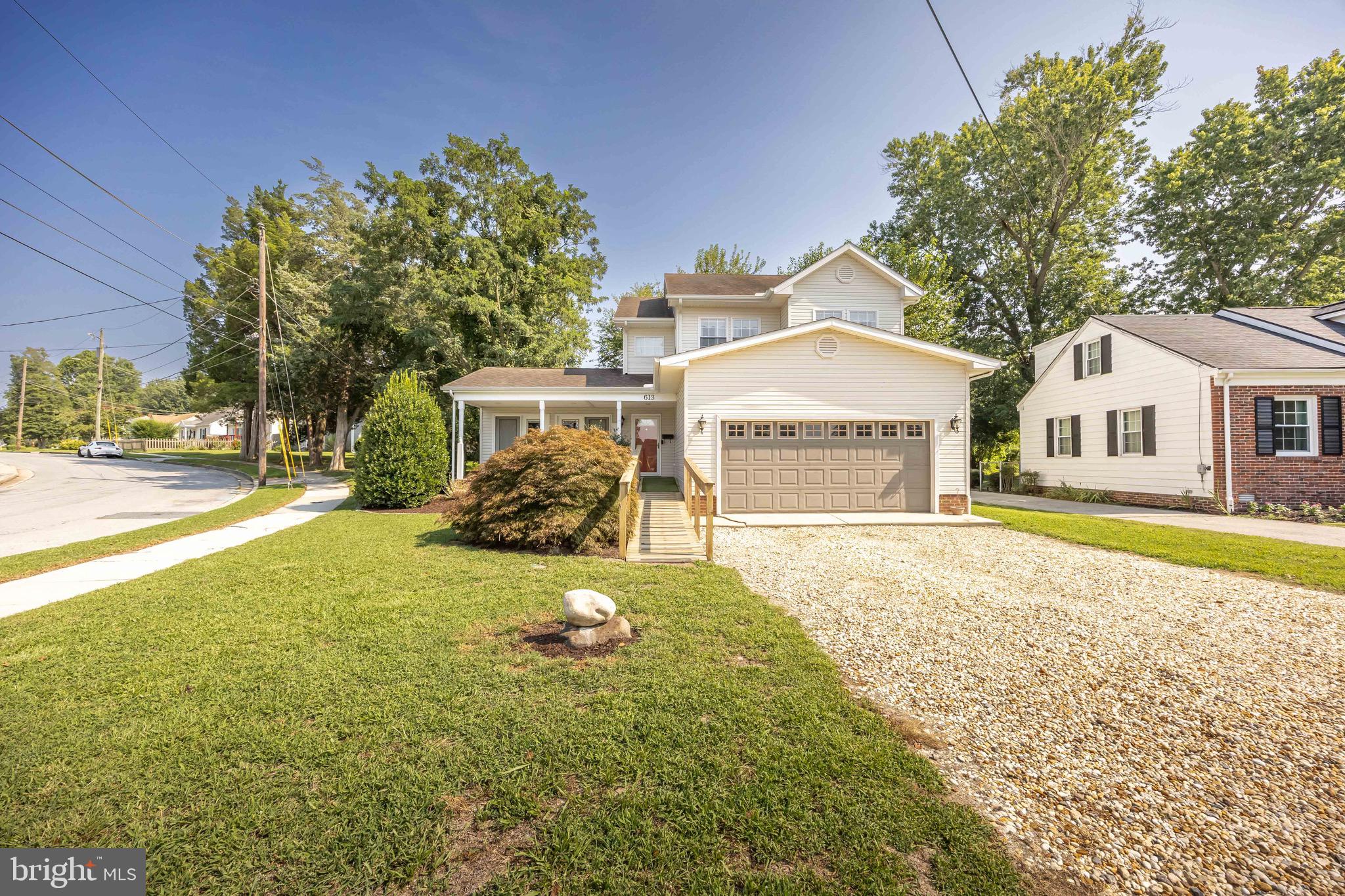 613 Lakeside Drive Salisbury, MD 21801 - Photo 1 of 50 a front view of a house with a yard and garage