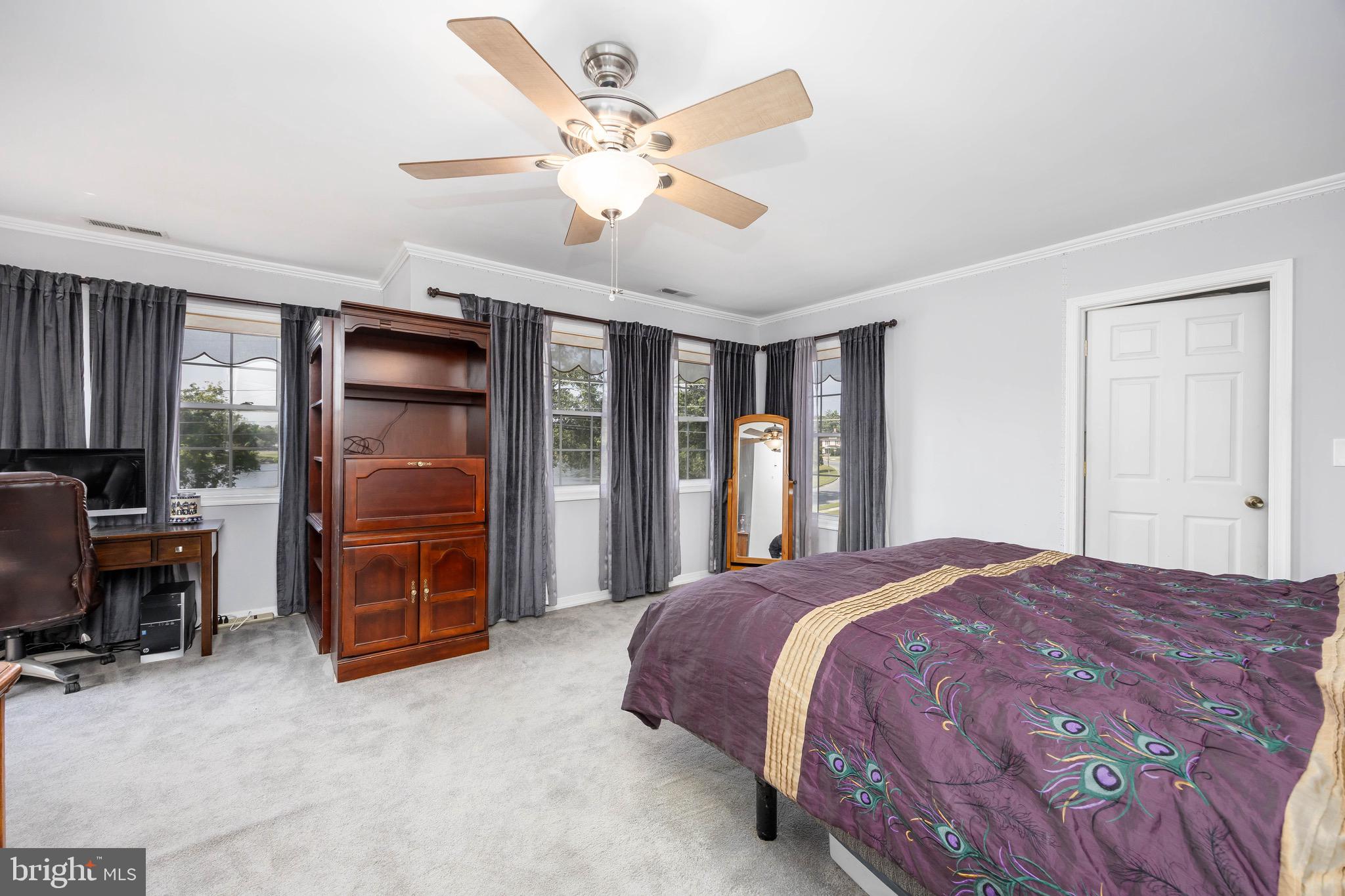613 Lakeside Drive Salisbury, MD 21801 - Photo 26 of 50 a spacious bedroom with a bed and a desk
