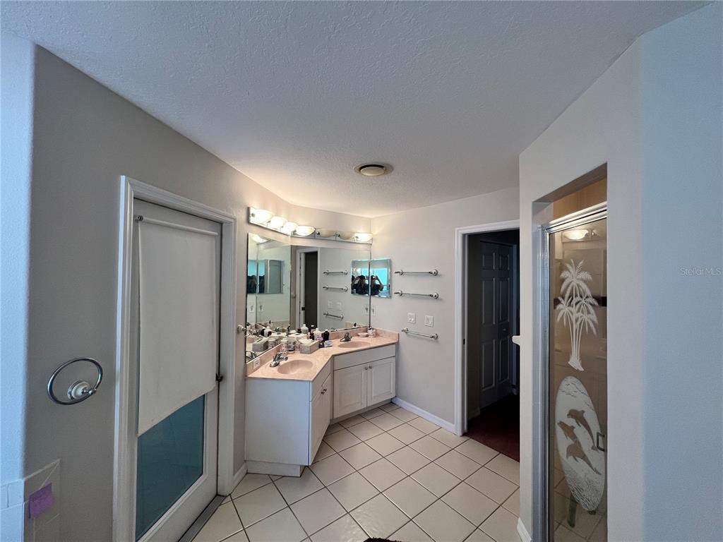 1995 East Newhaven Street Inverness, FL 34453 - Photo 30 of 48 a room with a sink and a mirror
