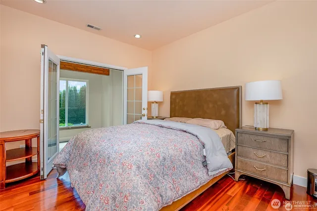 a view of wooden floor and windows in a room