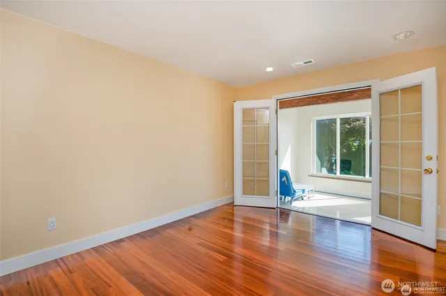 a large room with closet and a fireplace