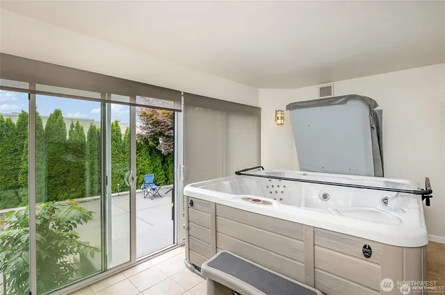 a view of a house with a yard and a fountain